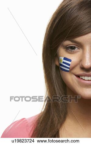 Picture - Young Female Sports Fan With Uruguayan Flag Painted On Face. Fotosearch