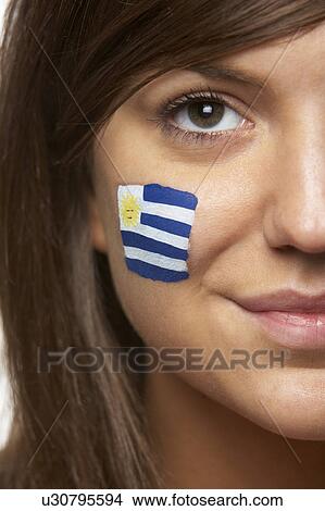 Picture - Young Female Sports Fan With Uruguayan Flag Painted On Face. Fotosearch