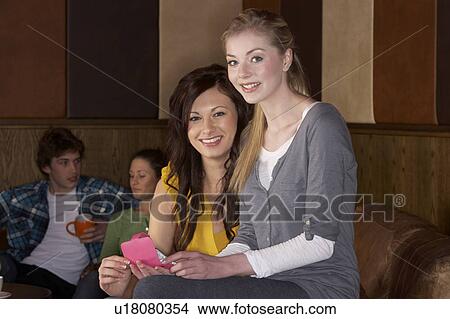 Young friends in café View Large Photo Image Picture - Young friends in café. Fotosearch