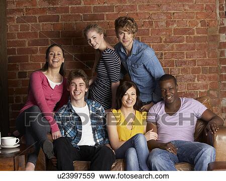 Stock Photo - Young friends in cafÃ©. Fotosearch