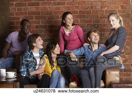 Stock Photo - Young friends in cafÃ©. Fotosearch