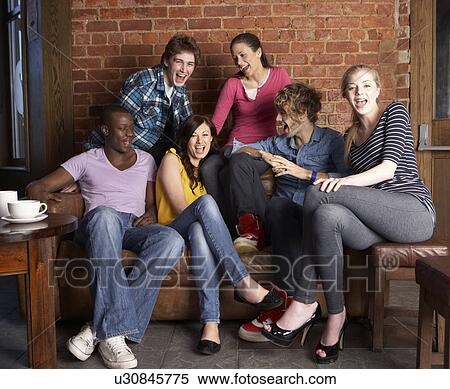 Young friends in café View Large Photo Image Stock Photography - Young friends in café. Fotosearch