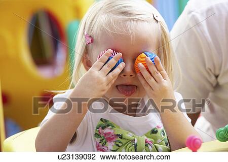 Young girl playing with toys View Large Photo Image Stock Image - Young girl playing with toys. Fotosearch