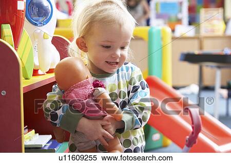 Young girl playing with toys View Large Photo Image Stock Photography - Young girl playing with toys. Fotosearch