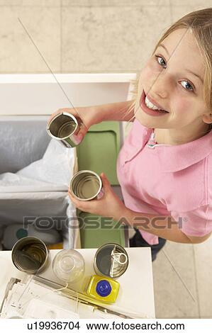 Young Girl Recyling Waste At Home View Large Photo Image Picture - Young Girl Recyling Waste At Home. Fotosearch
