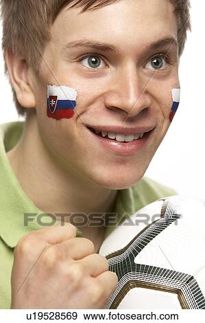 Young Male Football Fan With Slovakian Flag Painted On Face View Large Photo Image Stock Photo - Young Male Football Fan With Slovakian Flag Painted On Face. Fotosearch