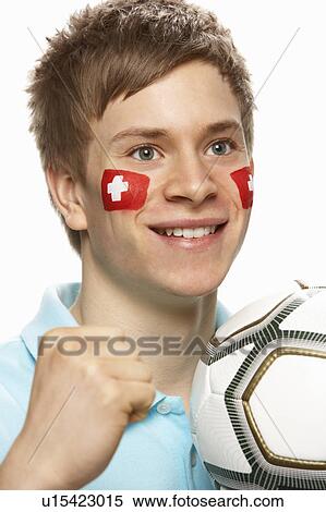 Young Male Football Fan With Swiss Flag Painted On Face View Large Photo Image Stock Photography - Young Male Football Fan With Swiss Flag Painted On Face. Fotosearch