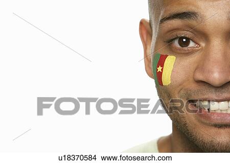 Young Male Sports Fan With Cameroon Flag Painted On Face View Large Photo Image Picture - Young Male Sports Fan With Cameroon Flag Painted On Face. Fotosearch