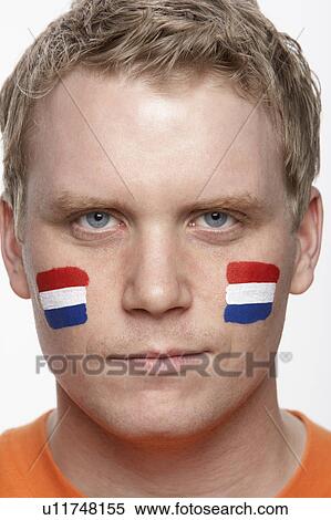 Young Male Sports Fan With Dutch Flag Painted On Face View Large Photo Image Stock Photography - Young Male Sports Fan With Dutch Flag Painted On Face. Fotosearch