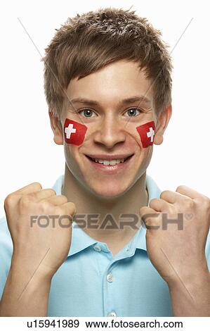 Young Male Sports Fan With Swiss Flag Painted On Face View Large Photo Image Stock Photo - Young Male Sports Fan With Swiss Flag Painted On Face. Fotosearch
