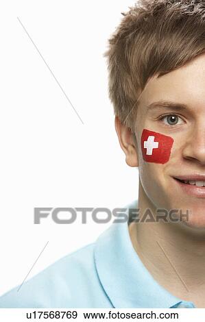 Stock Photo - Young Male Sports Fan With Swiss Flag Painted On Face. Fotosearch