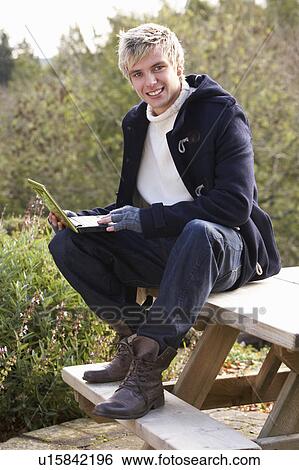 Young man with laptop computer View Large Photo Image Stock Photograph - Young man with laptop computer. Fotosearch