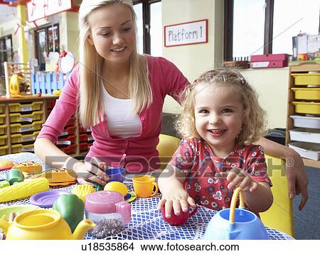 Young woman playing with girl View Large Photo Image Picture - Young woman playing with girl. Fotosearch