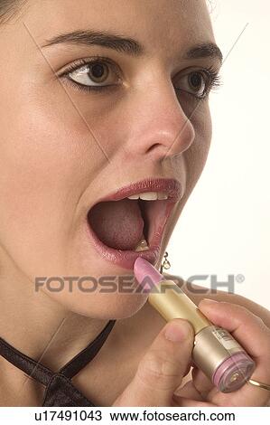 Applying lipstick View Large Photo Image Stock Image - Applying lipstick. Fotosearch