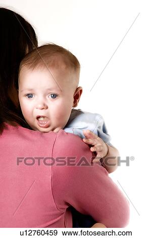 Baby getting burped View Large Photo Image Stock Photo - Baby getting burped. Fotosearch