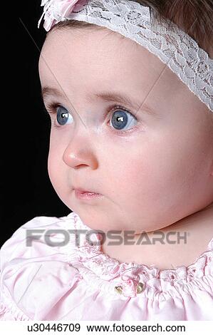 Stock Photo - Baby girl's face. Fotosearch