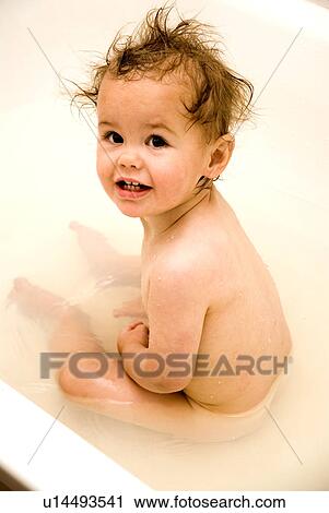 Stock Image - Baby in a bath. Fotosearch
