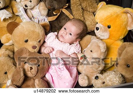 Stock Image - Baby with teddy bears. Fotosearch