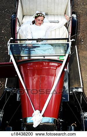 Bride in wedding car View Large Photo Image Stock Image - Bride in wedding car. Fotosearch