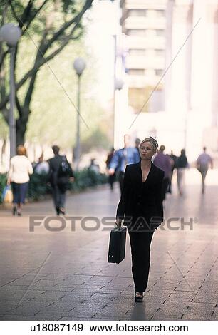 Business people walking outdoors View Large Photo Image Stock Photo - Business people walking outdoors. Fotosearch