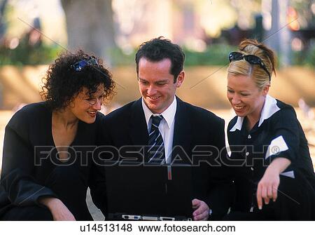 Business professionals working outside View Large Photo Image Stock Photo - Business professionals working outside. Fotosearch