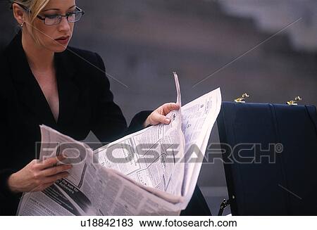 Business woman reading newspaper View Large Photo Image Stock Image - Business woman reading newspaper. Fotosearch