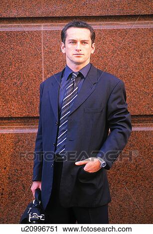 Businessman outside a building View Large Photo Image Stock Image - Businessman outside a building. Fotosearch