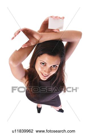 Stock Image - Businesswoman with business cards. Fotosearch