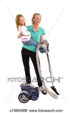 Busy mom vacuuming View Large Photo Image Stock Photo - Busy mom vacuuming. Fotosearch