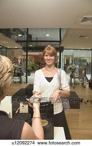 Buying shoes View Large Photo Image Picture - Buying shoes. Fotosearch