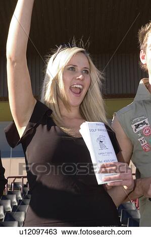 Stock Image - Cheering a winner home. Fotosearch