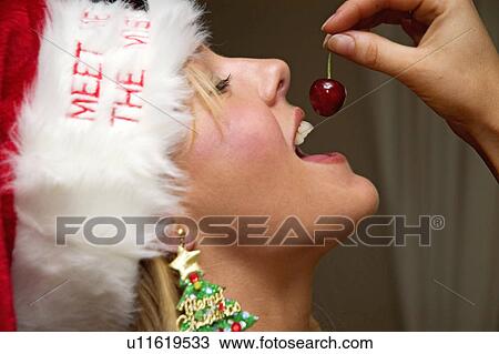 Cherry eating on Christmas View Large Photo Image Stock Image - Cherry eating on Christmas. Fotosearch