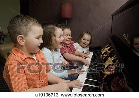 Children at piano View Large Photo Image Stock Image - Children at piano. Fotosearch