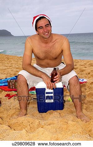 Stock Photo - Cool beer on Christmas day. Fotosearch