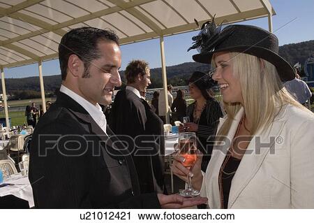 Couple at the races View Large Photo Image Stock Image - Couple at the races. Fotosearch