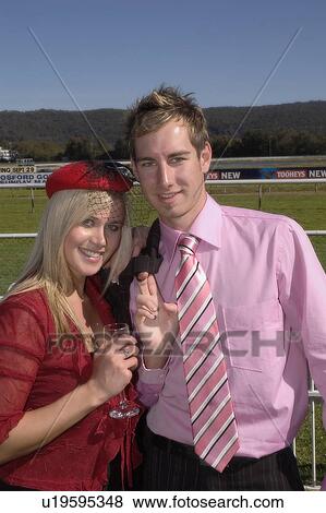 Stock Photo - Couple at the races. Fotosearch