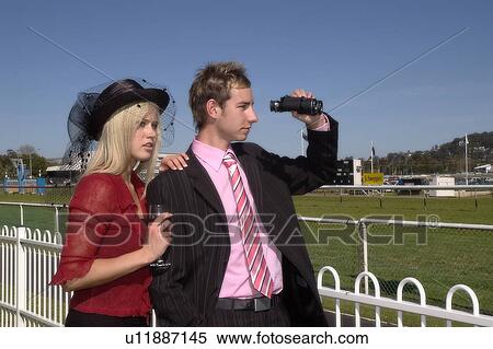Stock Photography - Couple at the races. Fotosearch