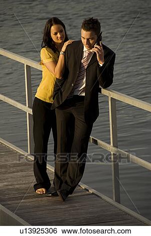 Stock Photograph - Couple on pier. Fotosearch