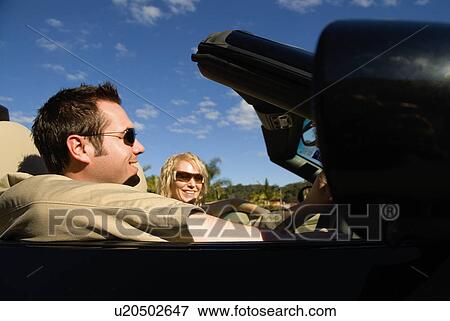 Stock Photo - Couple on Sunday drive. Fotosearch