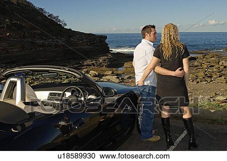 Couple parked at the beach View Large Photo Image Stock Image - Couple parked at the beach. Fotosearch
