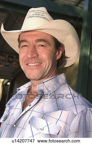 Cowboy outside pub View Large Photo Image Stock Photo - Cowboy outside pub. Fotosearch