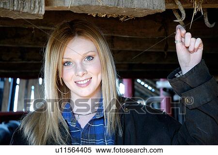 Cowgirl in wool shed View Large Photo Image Stock Photography - Cowgirl in wool shed. Fotosearch