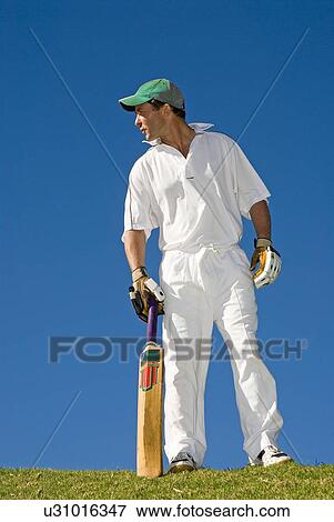 Stock Photo - Cricketer at bowling crease. Fotosearch