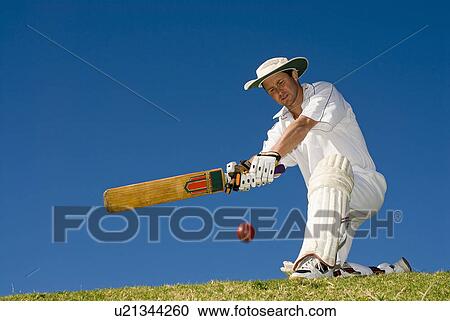 Cricketer playing a sweep shot View Large Photo Image Stock Image - Cricketer playing a sweep shot. Fotosearch