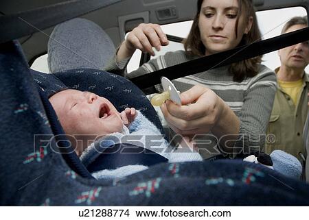 Crying baby in a car seat View Large Photo Image Picture - Crying baby in a car seat. Fotosearch