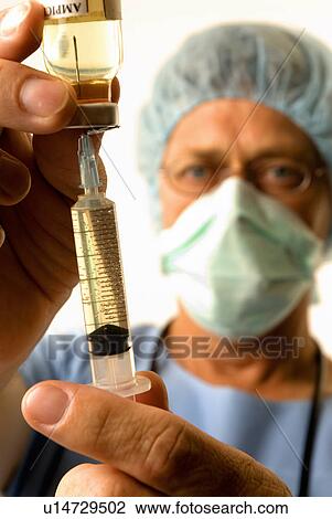 Doctor filling needle View Large Photo Image Stock Image - Doctor filling needle. Fotosearch