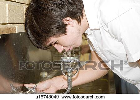 Drinking at the water fountain View Large Photo Image Stock Photo - Drinking at the water fountain. Fotosearch