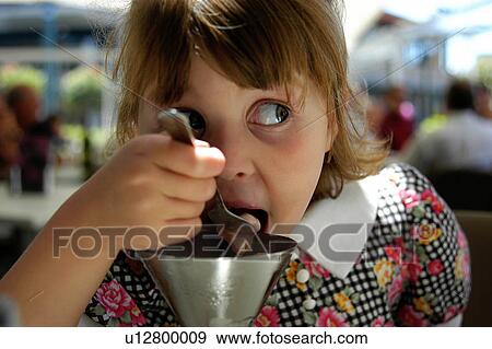Stock Photo - Eating ice cream. Fotosearch