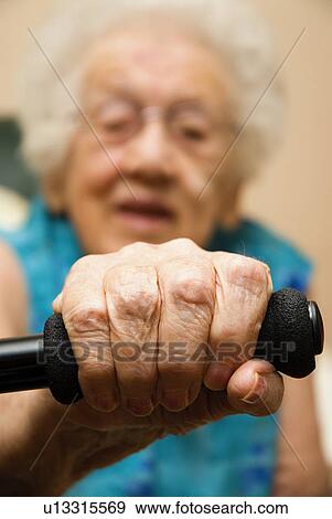 Elderly hand on a cane View Large Photo Image Stock Photo - Elderly hand on a cane. Fotosearch
