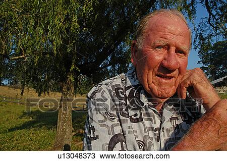 Stock Image - Elderly man on rural property. Fotosearch